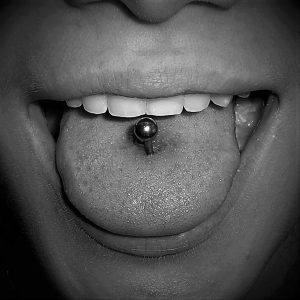 Male tongue piercing